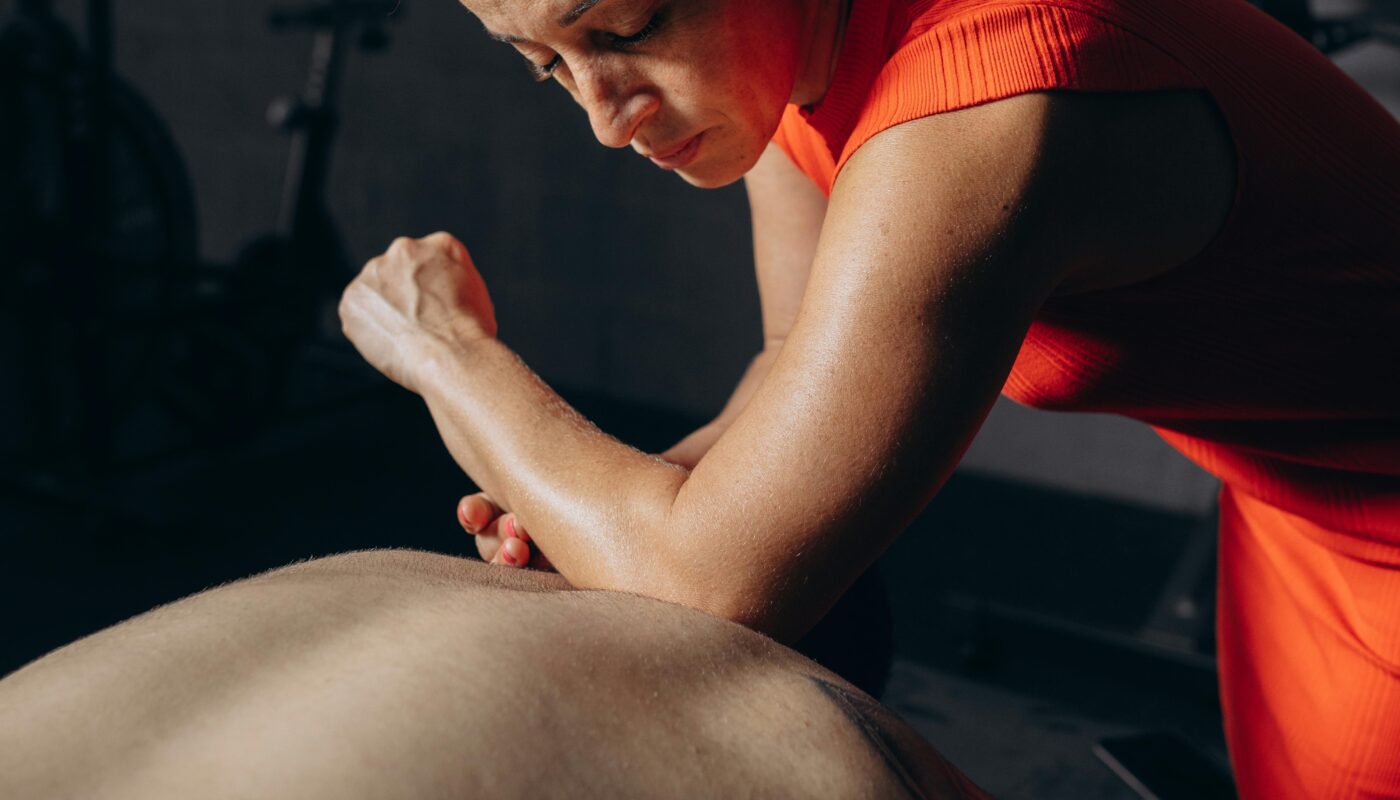 Photo by Jonathan Borba: https://www.pexels.com/photo/a-woman-getting-a-massage-in-a-gym-27730475/