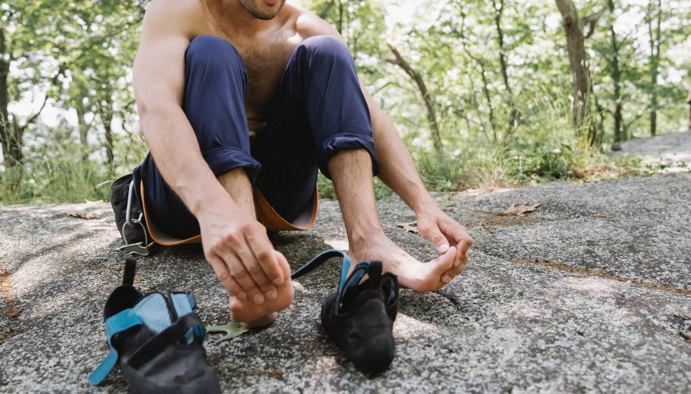 Photo by Katya Wolf: https://www.pexels.com/photo/a-man-resting-and-holding-his-feet-while-sitting-on-the-ground-8728681/