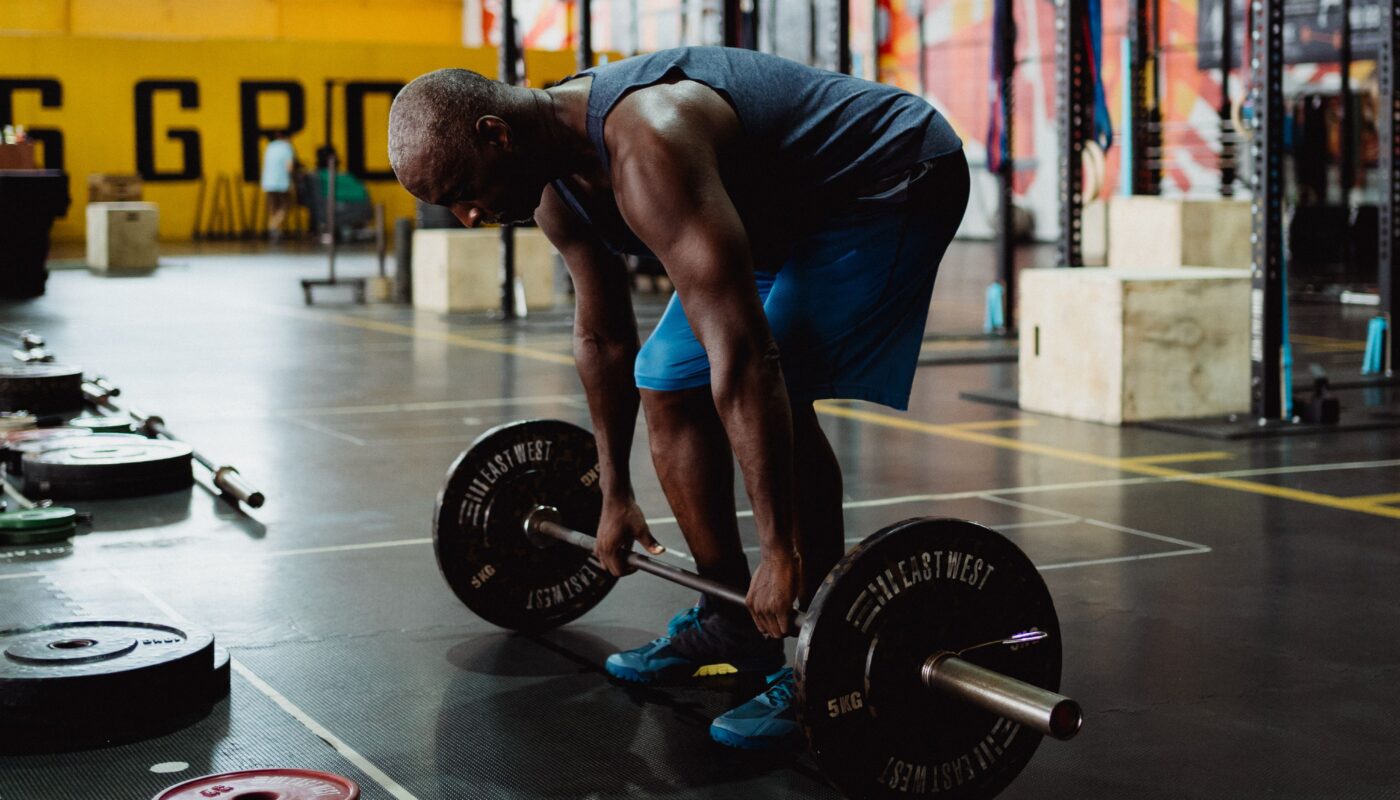 Photo by Ketut Subiyanto: https://www.pexels.com/photo/man-in-blue-tank-top-and-blue-shorts-holding-a-barbell-4720792/