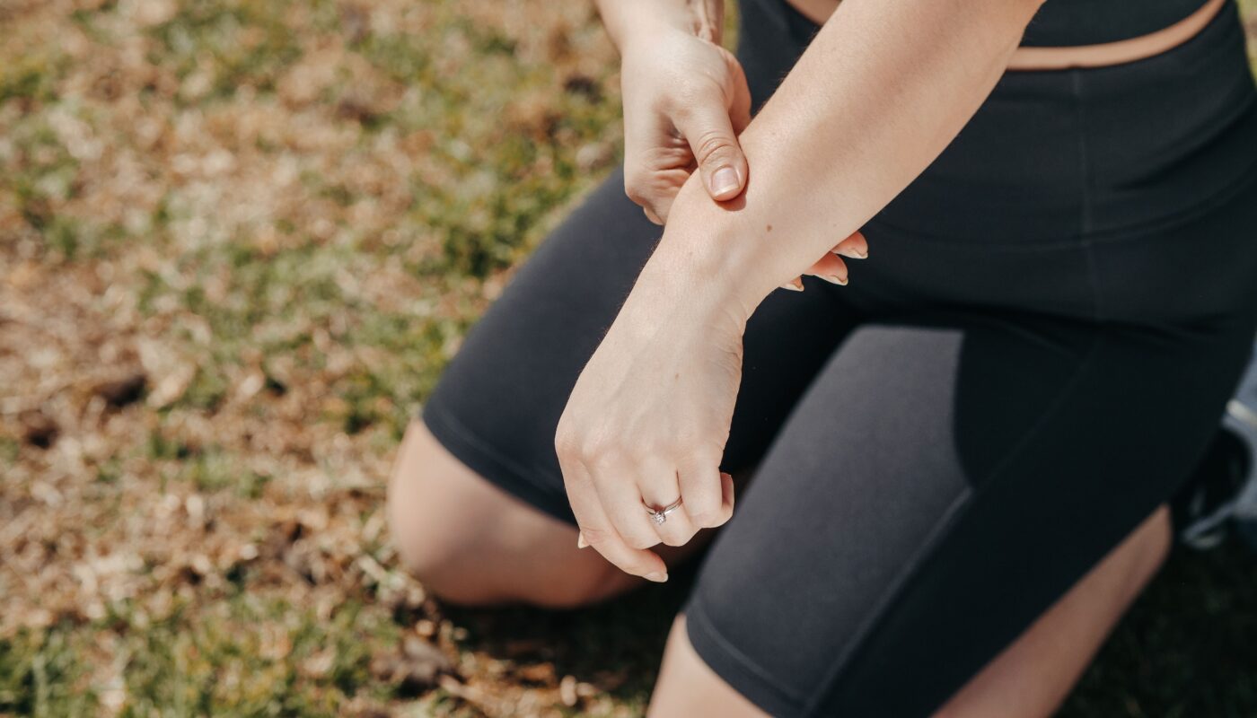 Photo by Kindel Media: https://www.pexels.com/photo/person-in-black-active-wear-sitting-on-a-grass-field-7298402/