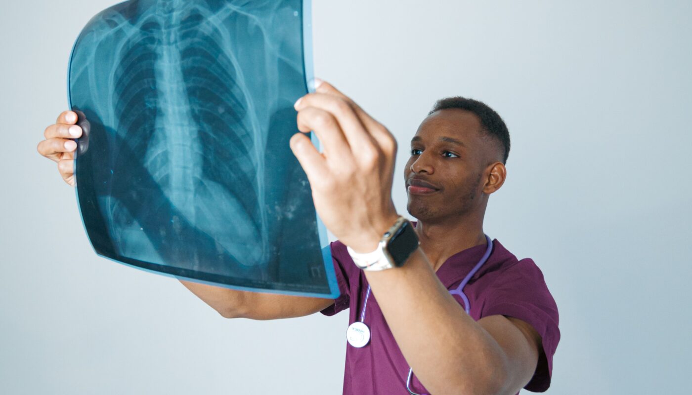 Photo by Daniil Kondrashin: https://www.pexels.com/photo/medical-professional-analyzing-chest-x-ray-32254663/