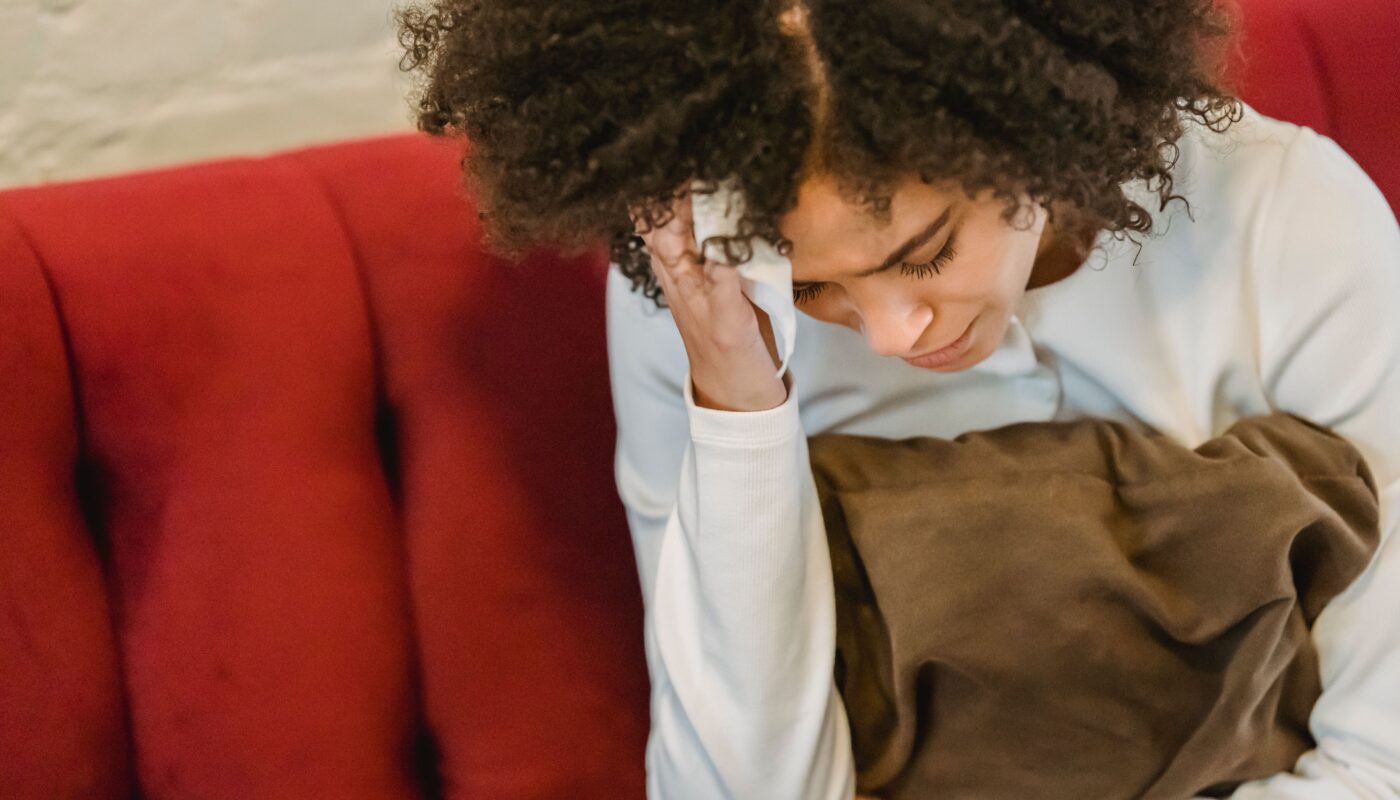 Photo by Liza Summer: https://www.pexels.com/photo/young-african-american-miserable-woman-touching-head-on-couch-6382647/