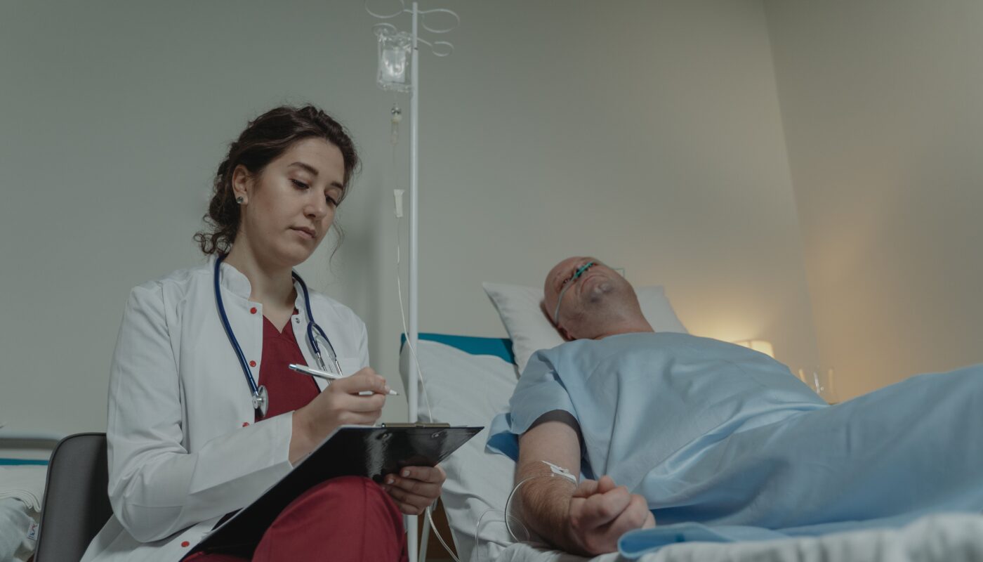 Photo by Tima Miroshnichenko: https://www.pexels.com/photo/doctor-sitting-beside-a-patient-6010782/