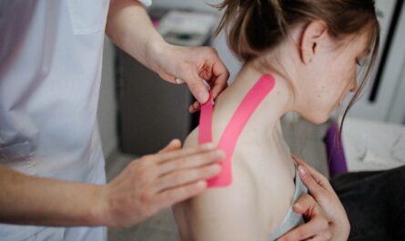 Photo by Danik Prihodko: https://www.pexels.com/photo/person-making-taping-to-woman-s-neck-8219055/