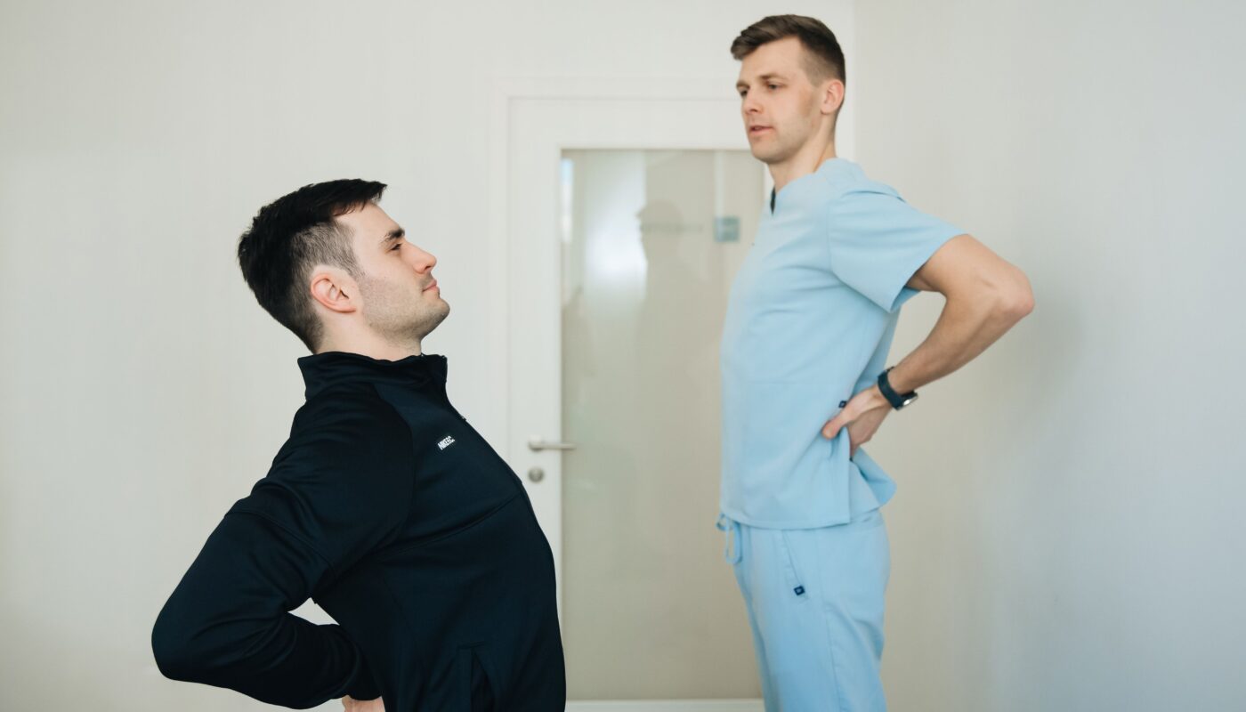 Photo by Funkcinės Terapijos Centras: https://www.pexels.com/photo/physiotherapist-instructing-a-patient-on-how-to-exercise-20860593/
