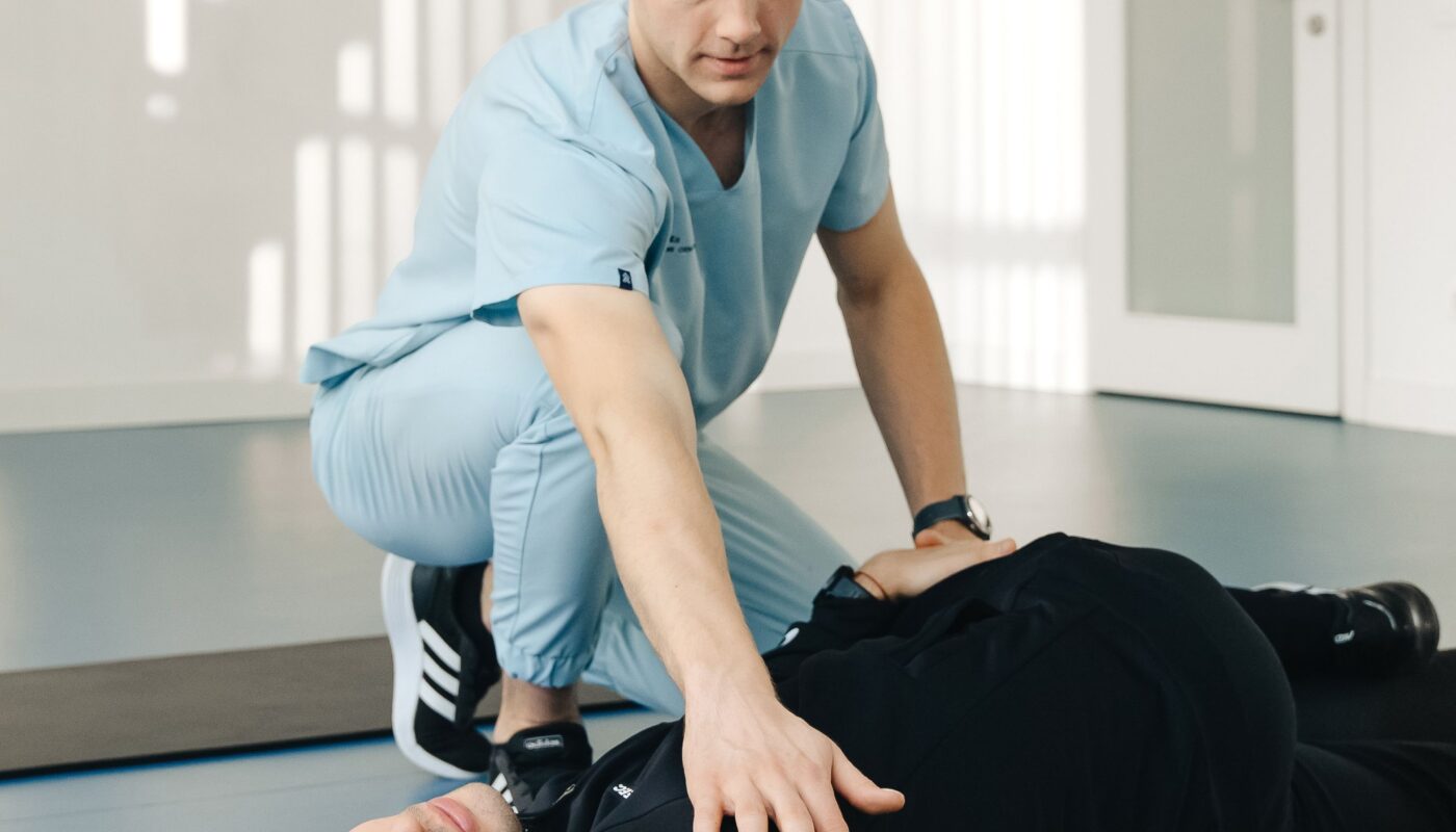 Photo by Funkcinės Terapijos Centras: https://www.pexels.com/photo/physiotherapist-crouching-over-exercising-patient-20860620/