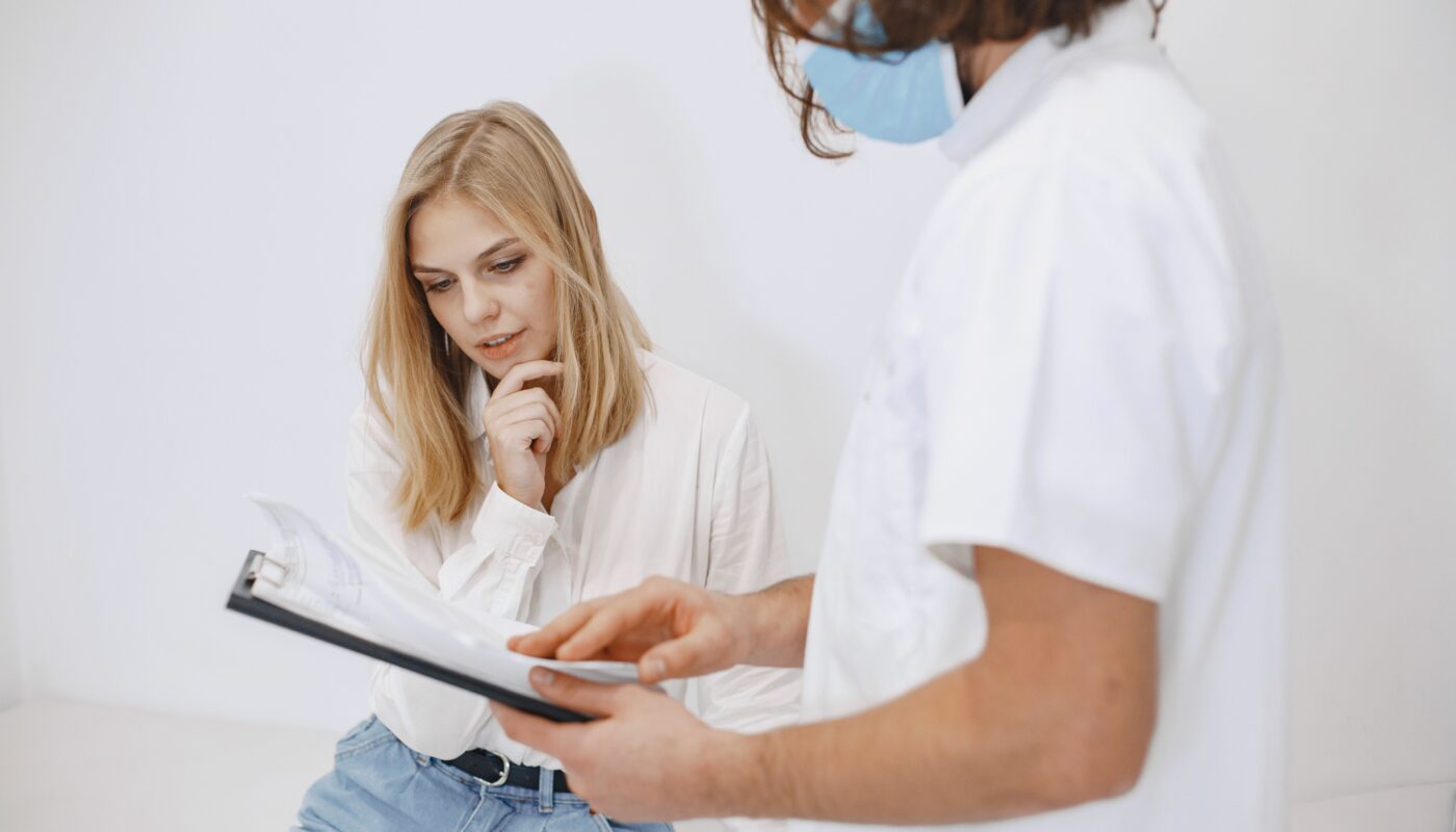 Photo by Gustavo Fring: https://www.pexels.com/photo/a-doctor-and-patient-looking-at-the-diagnosis-on-a-clipboard-6285399/