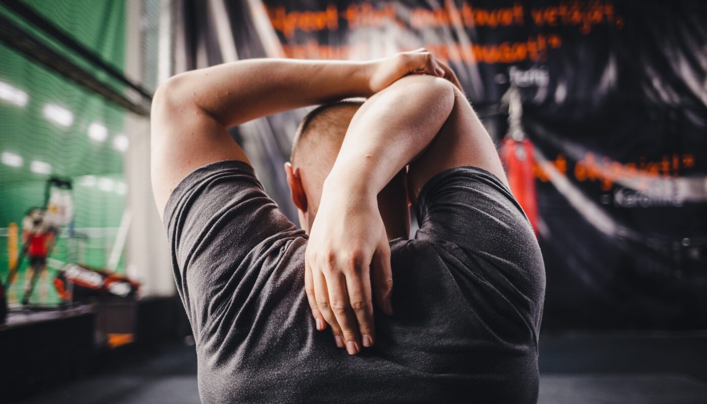 Photo by Joni Tuohimaa: https://www.pexels.com/photo/back-view-of-a-man-in-gray-shirt-stretching-8413737/
