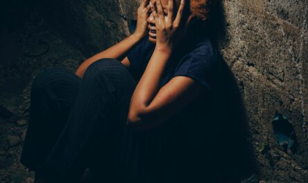 Photo by Kelvin Diri: https://www.pexels.com/photo/woman-with-curly-hair-crying-in-a-narrow-alley-20500387/