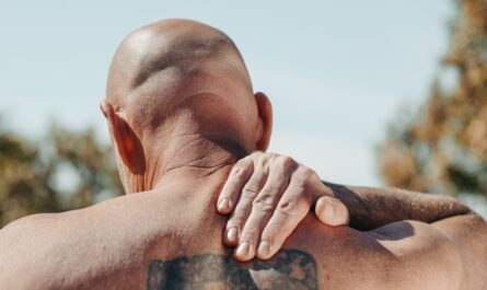 Photo by Kindel Media: https://www.pexels.com/photo/man-with-tattoo-on-his-back-massaging-his-neck-7298432/