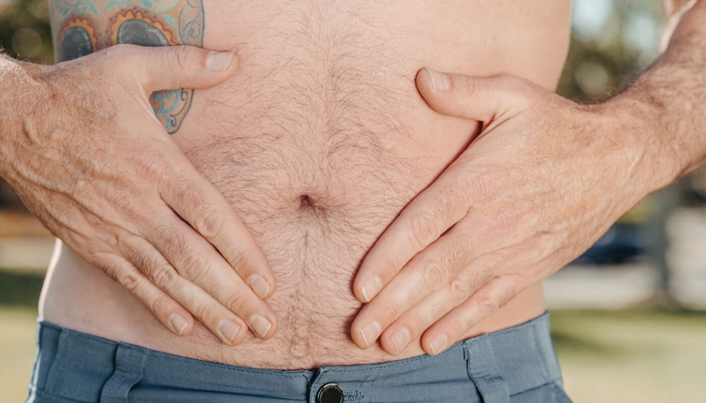 Photo by Kindel Media: https://www.pexels.com/photo/a-person-holding-his-stomach-7298442/