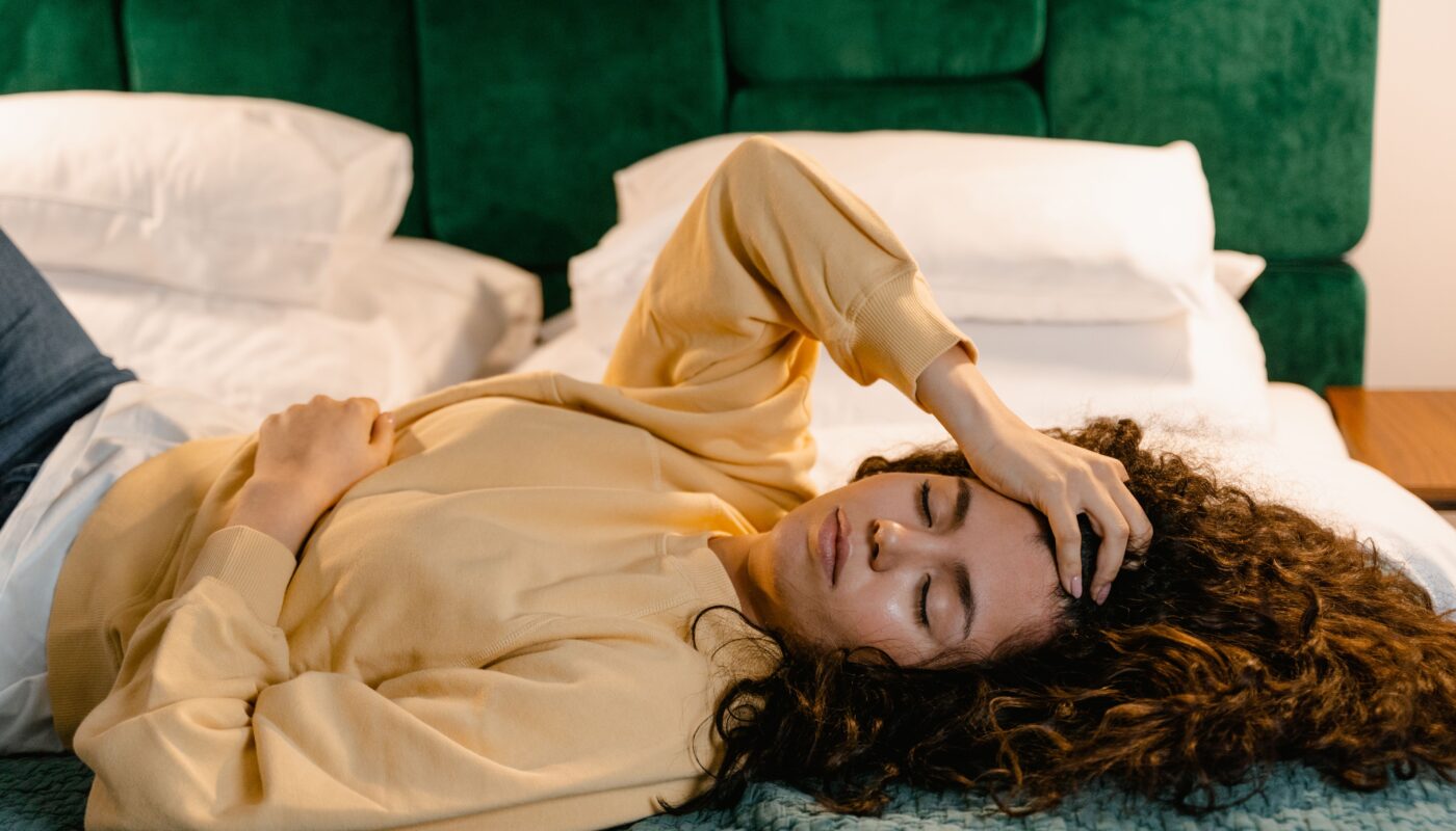 Photo by MART PRODUCTION: https://www.pexels.com/photo/a-woman-in-yellow-sweater-lying-on-bed-7605204/