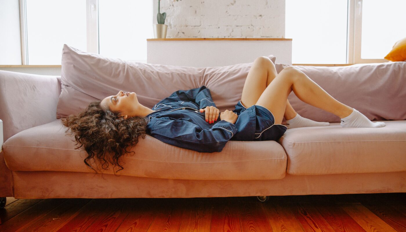 Photo by Polina Zimmerman: https://www.pexels.com/photo/woman-suffering-from-a-stomach-pain-lying-down-on-couch-3958561/